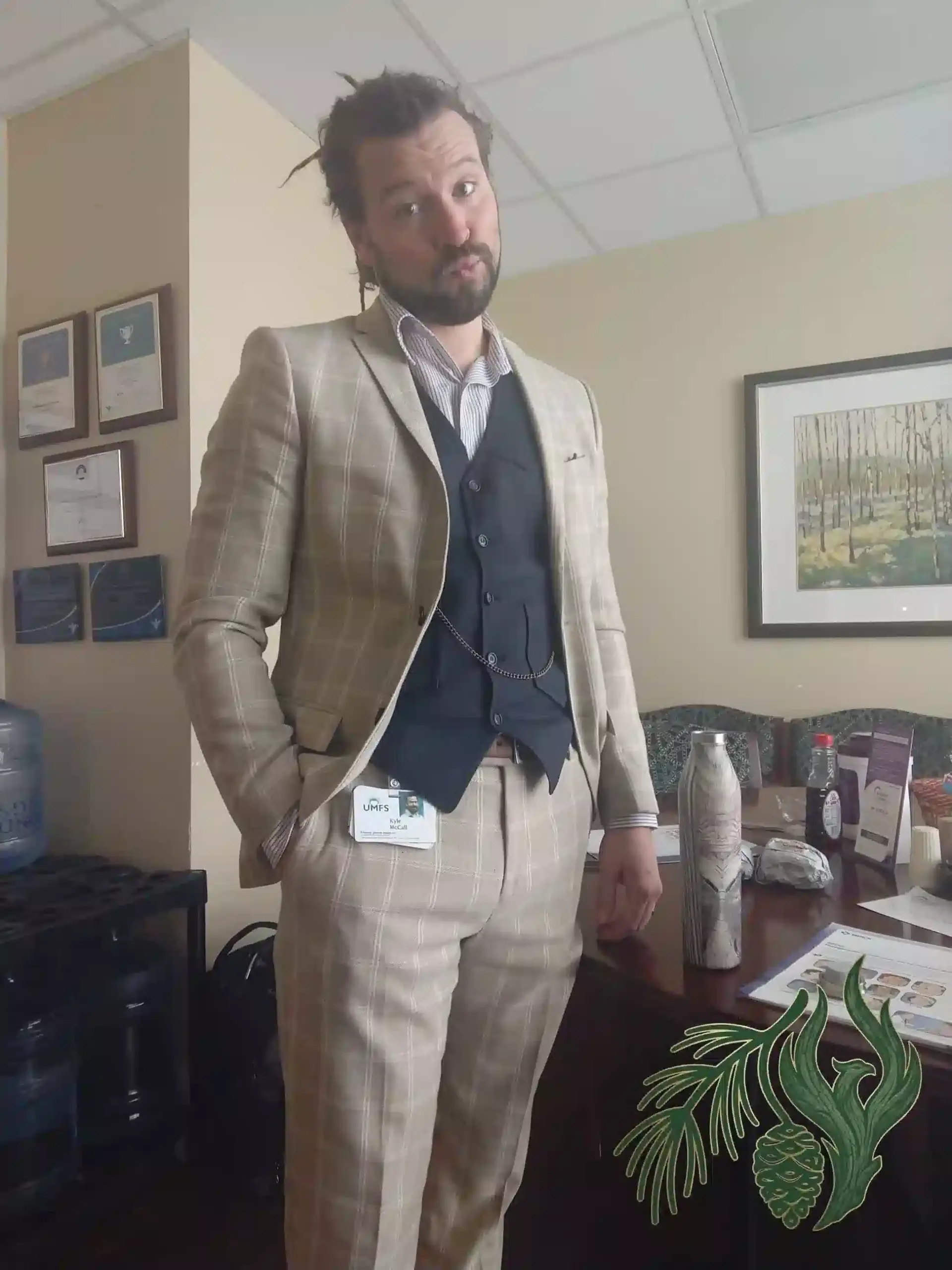 Kyle McCall, LPC-S, standing in an office wearing a suit and vest during his time managing an integrated behavioral health program.